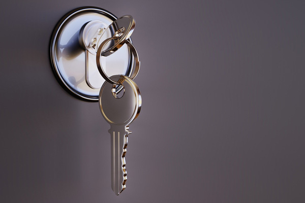 Keys on keyring in lock illustrating the key to unlocking a better solution.
