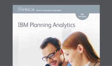 Man and woman collaborating on unseen document set against a grey background.